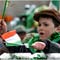 child rides on Saint Patrick's Day parade float