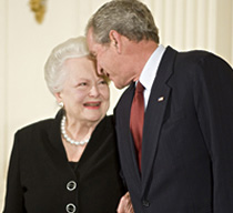 President Bush
              affectionately leans into Olivia de Havilland