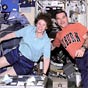 Flight Engineers Susan Helms and James Voss pose for a photograph inside the Zvezda Service Module.