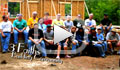 Missionaries sitting beside a construction site