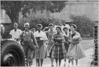 Soldier leads black high school students to class (Bettman/CORBIS)