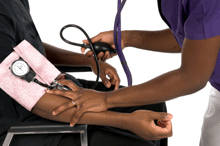 photo of a nurse taking an African American man's blood pressure.