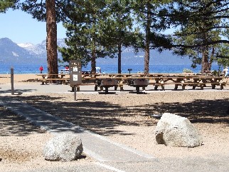 [Photo]: Color photo of the picnic area at Nevada Beach.