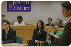 As part of the President's Helping America's Youth initiative, Mrs. Laura Bush observes a mock trial at the Colonie Youth Court in Latham, New York, Wednesday, October 4, 2006. The Colonie Youth Court has been recognized by the U.S. Department of Justice as a national model of effective programming to help at-risk youth. The court has been replicated in more than 80 communities in the state of New York. White House photo by Shealah Craighead