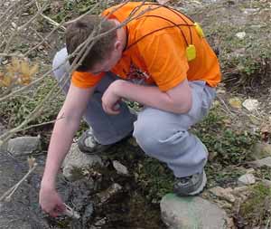 A student checking electrical conductivity of water