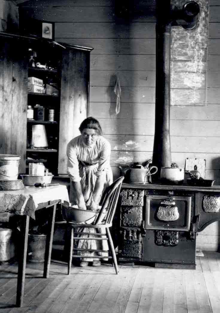 Self-portrait kneading bread by Evelyn Cameron MHS Photo Archives #PAc 80.87.35-5