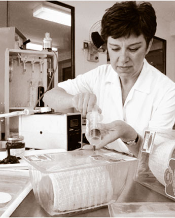 Photo of a laboratory worker testing food additives to be used commerically.