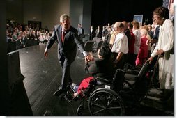 HP8C1942.jpg President George W. Bush greets seniors after a conversation on Medicare-approved prescription drug discount cards in Liberty, Mo., June 14, 2004.  White House photo by Paul Morse