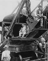 President Theodore Roosevelt testing a steam shovel (© AP Images)