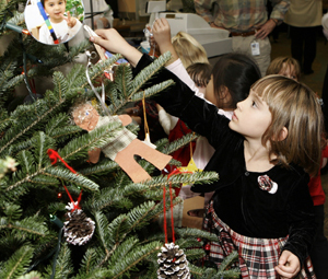 For the some of the small children, the best part of International Day was decorating the tree.
