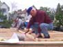Field Office Director Louis Berra lends a helping hand on the construction of the homes as a part of Leadership Build day