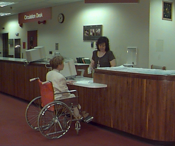 Library staff assisting patron