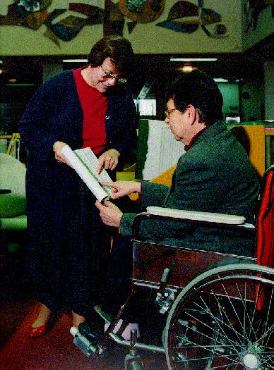 Library staff assisting patron