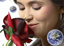Woman smelling rose, surrounded by floating Earth images.