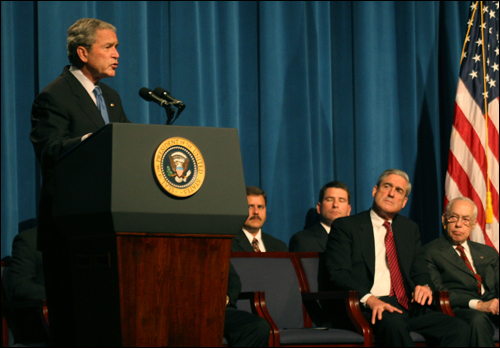 President Bush gives remarks as Director Mueller, Attorney General Mukasey, and others look on