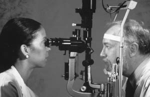 Photo of a man getting an eye exam.