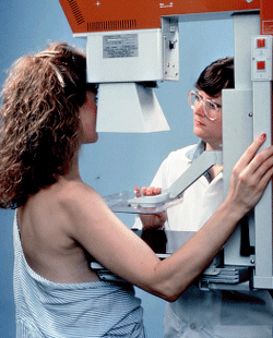 Photo of female patient getting a mammogram.