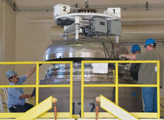 Laboratory personnel place the inner lid on one of three TRUPACT containers of high-activity waste - the Laboratory's final 2008 shipment to the Waste Isolation Pilot Plant near Carlsbad. "This is a significant achievement for the Laboratory," said Mark Shepard of Los Alamos's Waste Disposition Project. "It closes a chapter on the February 2007 commitment to the Defense Nuclear Facilities Safety Board to prioritize characterization and disposal of the highest-risk transuranic [TRU] wastes stored at Technical Area 54, Area G," he said. A total of 282 high-activity drums were shipped to WIPP as part of this campaign.