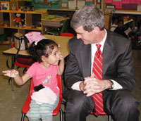 photo - Miller gets a lesson from one of his youngest constituents during a Head Start visit in Burlington.