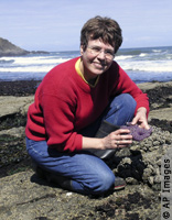 Jane Lubchenco poses on shoreline (AP Images)