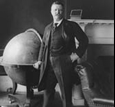 Theodore Roosevelt posing right to an earth globe map