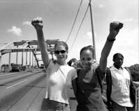 Young women standing on bridge (Courtesy Lloyd Wolf and Yaakov Hammer)