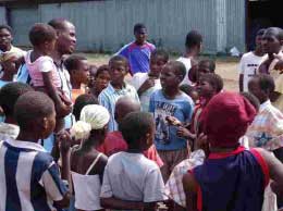 Khumo "Shoes" Motlhabane interacts with youth in Pandamatenga