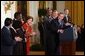 President George W. Bush acknowledges school principals and superintendents, education leaders, and Members of Congress in celebrating the one-year anniversary of the signing of the No Child Left Behind Act in the East Room, Wednesday, Jan. 8, 2003.  White House photo by Tina Hager