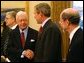 President George W. Bush greets former President Jimmy Carter during a photo opportunity in the Oval Office with the Nobel Laureates Monday, Nov.18. "These Americans are a great honor to their fields and a great honor to our country. And we're proud to have you here. We're proud for what you've done, for not only America but the world. And we're proud for your contributions," said President Bush.  White House photo by Tina Hager