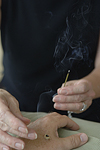 Moxibustion involves the application of heat from the burning of the herb moxa at the acupuncture point. © Bob Stockfield