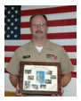 Captain Mike Gressel with his award from the U.S. Health Service