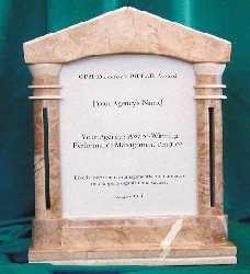 photo of award item: marble pillar frame inscribed on smoked-glass insert with recipient's organizational name and name of award-winning program
