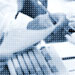 Photo of man reading document at desk