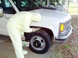 RAP team member surveying vehicle.