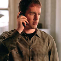 Photograph of man talking on a cell phone