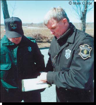 Photograph of Law Enforcement Task Force Members Conferring