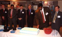 William Magwood, Director, Office of Nuclear Energy, Science and Technology, cuts a cake at the dedication.  Joining him are Ralph Erickson, Manager, NNSA/Los Alamos; New Mexico Governor Bill Richardson; LANL Director Pete Nanos; U.S. Senator Jeff Bingaman; and Tom Meyer, LANL Associate Director for Strategic Research.