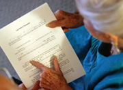 Picture of elderly woman looking at documents