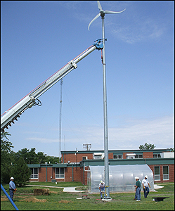 A photo of a Skystream wind turbine being erected by the Walton Rural Life Elementary Charter School in Walton, Kansas.                                                                                                                                                                                     