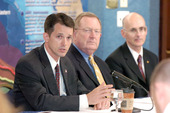 Kevin Kolevar (left) discusses DOE's hurricane preparedness efforts with Red Cavaney (center) of the American Petroleum Institute and Bud Danenberger (right) of the Department of the Interior's Minerals Management Service.