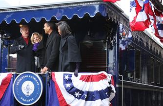 President-elect Barack Obama, vice president-elect Joe Biden and their wives greet a Wilmington, Del., crowd on their way to Washington, D.C.