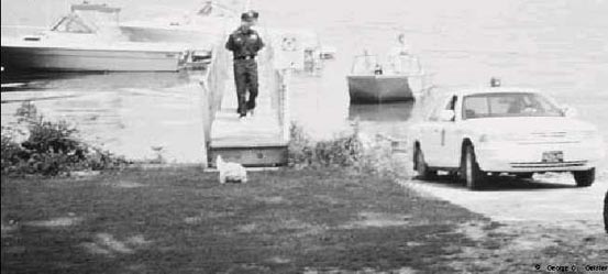 Photograph of Waterways conservation Officer Walking on a boat dock