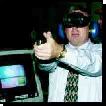 Photograph of man waring virtual reality goggles for firearms training