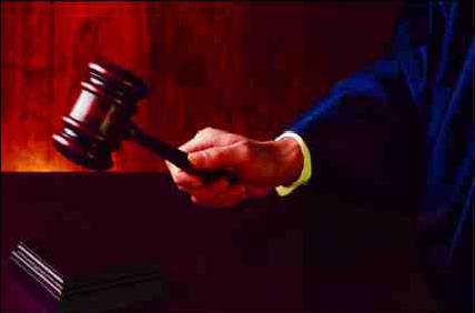 Photograph of judge pounding a gavel