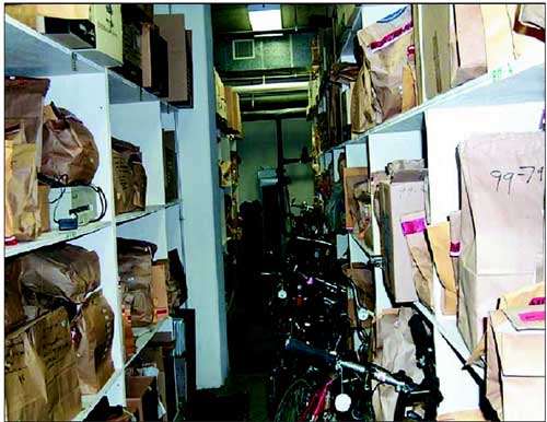 Photograph of bags of crime scene evidence stored in police department property room