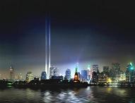 the original site of the twin towers now illuminated by two beams of light  