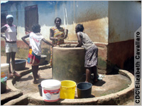 Girls at well (Courtesy CDC\Elizabeth Cavallaro)