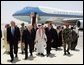 Vice President Dick Cheney, former Secretary of State Colin Powell, and former President George H.W. Bush are escorted from the plane by members of the Saudi delegation before meeting with the newly crowned King Abdullah of Saudi Arabia Friday, August 05, 2005. Vice President Dick Cheney led a delegation to pay respects following the recent death of King Fahd. White House photo by David Bohrer