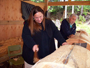 Commissioner Stamps works alongside Master Carver Stan Marsdin on the first totem pole carved in Kasaan in over fifty years.  The pole is symbolic of Haida culture, and will be one in a series of Healing Heart totem poles.