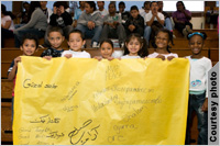 Students holding multilingual banner (Courtesy of Southern Poverty Law Center/Aaron Clamage)